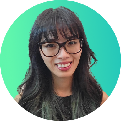 Image of an east asian woman wearing glasses with long hair, a smile, and green highlights.